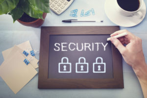 Man drawing security concept on chalkboard